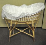 A wicker baby crib (moses basket),