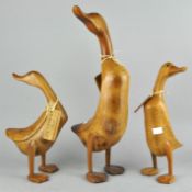 Three carved wooden figures of ducks,