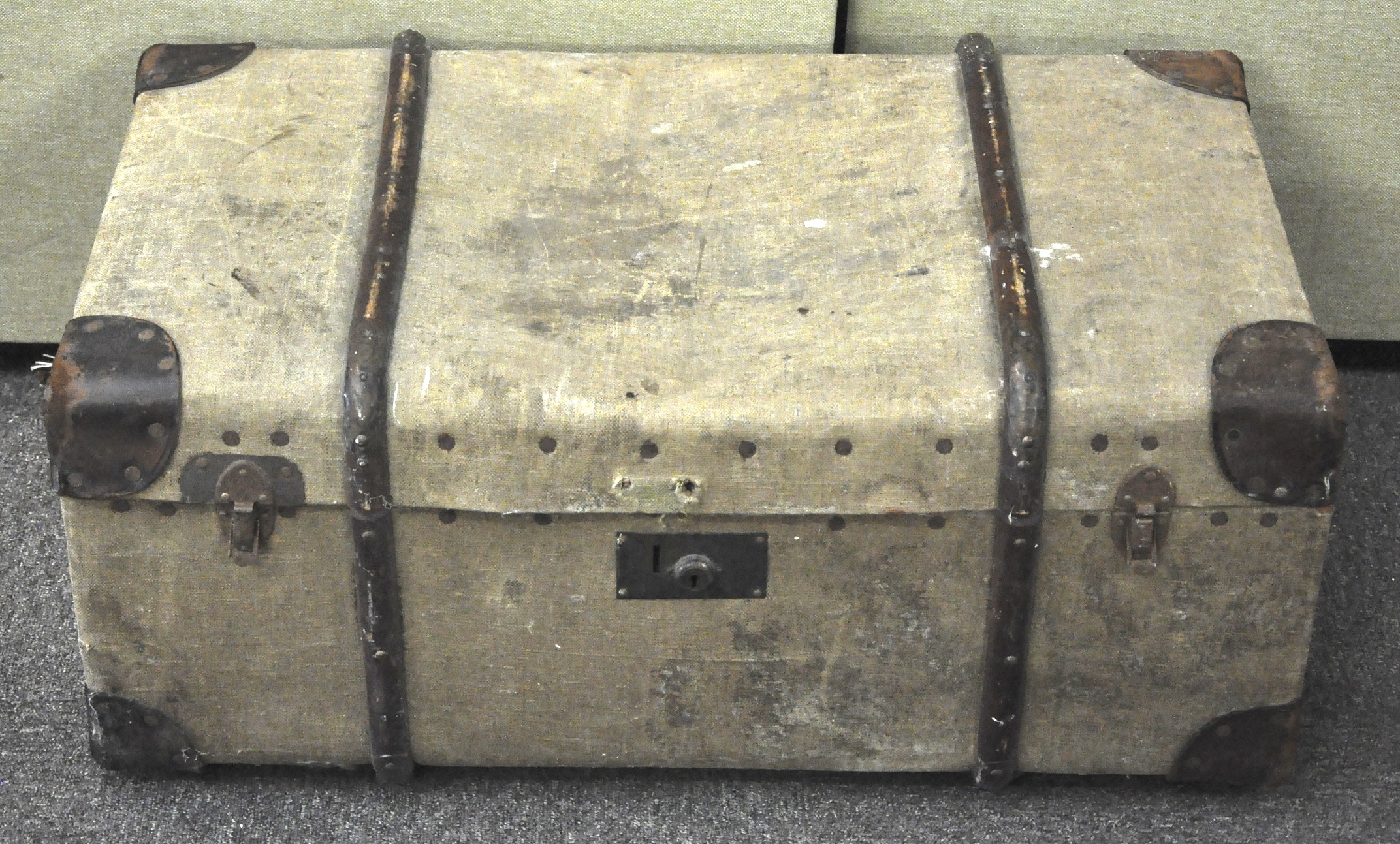 A canvas and wood bound steamer trunk,