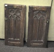 Two 19th century oak Gothic revival pew ends, with tracery carving and brass quatrefoil plaques,