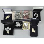 A collection of costume jewellery brooches,
