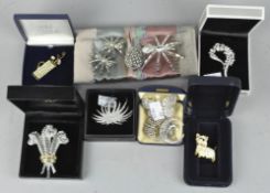 A collection of costume jewellery brooches,