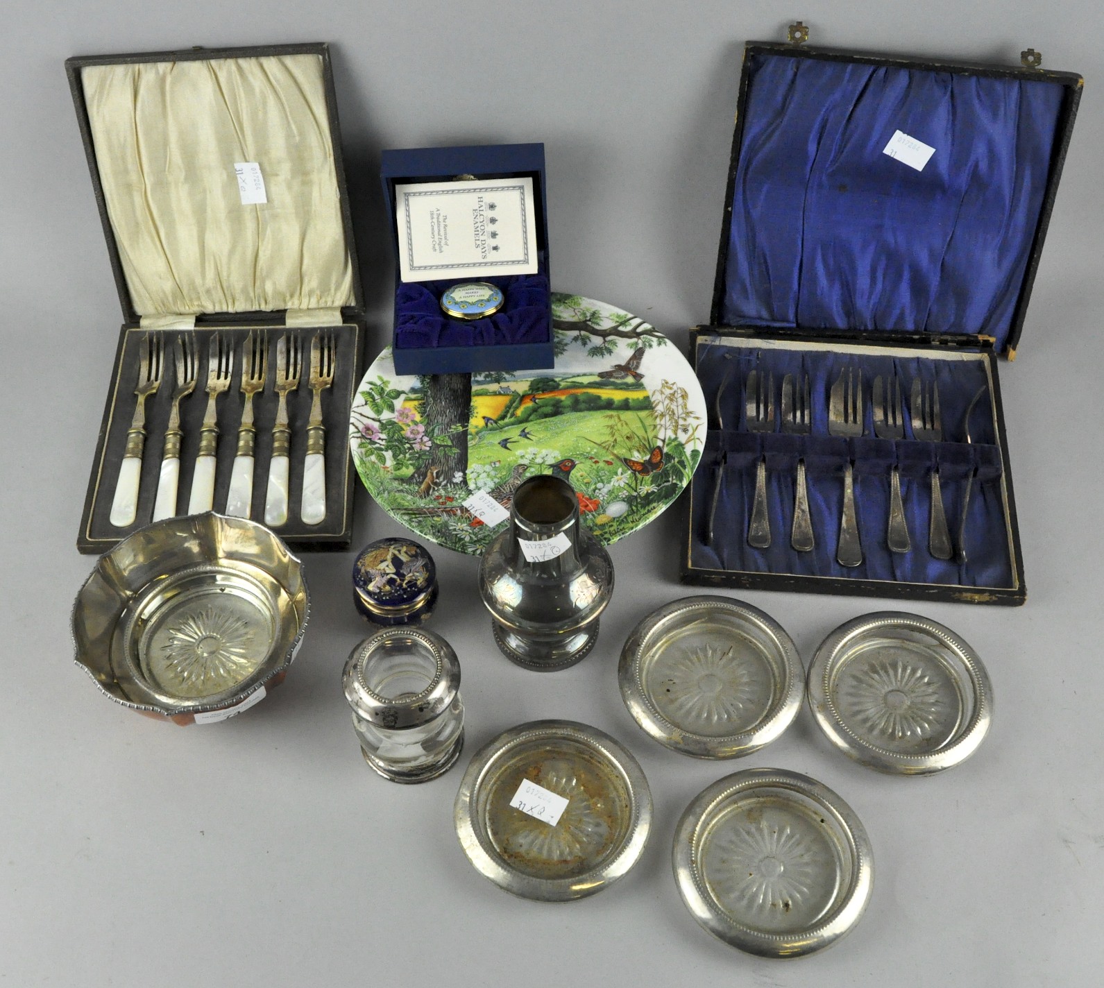 A collection of assorted items, including silver plated ash trays with glass bases,