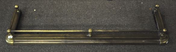 A brass fire fender,