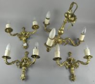 A brass ceiling light and two matching wall lights