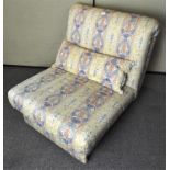 A polychrome patterned linen easy chair/z bed combination, with cushion,
