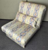 A polychrome patterned linen easy chair/z bed combination, with cushion,