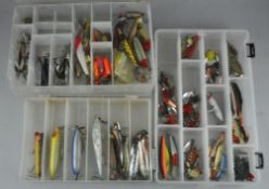 Three fishing tackle boxes with approximately 100 lures; spoons, spinners, replicants and plugs