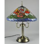 A contemporary 'Tiffany' style table lamp with stained glass shade,