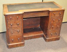 A Victorian mahogany desk with leather top over a central wide drawer,