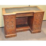 A Victorian mahogany desk with leather top over a central wide drawer,