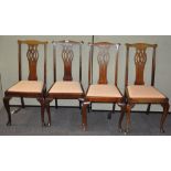 A set of eight mahogany dining chairs, including two carvers, 31cm wide, with upholstered seats,