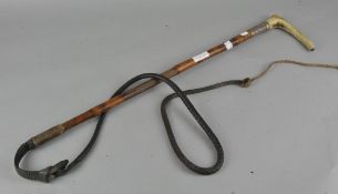 A silver collard bamboo riding crop