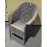 A blue painted Lloyd Loom armchair, label,