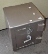 A large Chubb safe, with key,