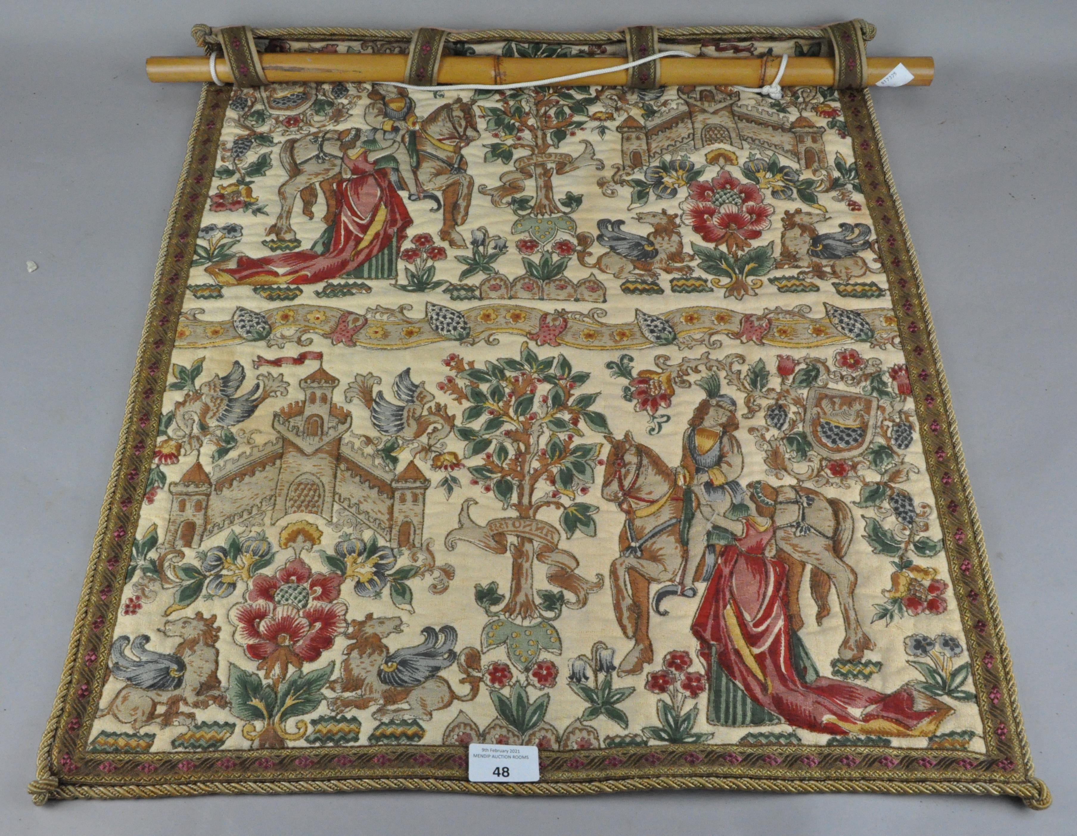 A wall hanging depicting a traditional scene,