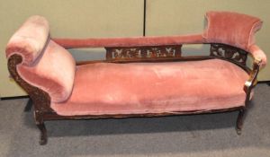 A 19th century chaise longue, upholstered in a salmon pink fabric,