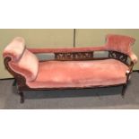 A 19th century chaise longue, upholstered in a salmon pink fabric,