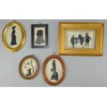 A collection of silhouettes, all framed and glazed,