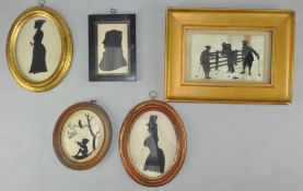 A collection of silhouettes, all framed and glazed,