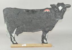 A novelty cow shaped blackboard,