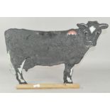 A novelty cow shaped blackboard,