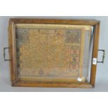 A reproduction printed map of Surrey, in the style of John Speede, cased,