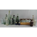 A collection of vintage glass bottles, including Boots the Chemist example,