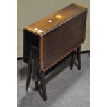 An Edwardian mahogany and satinwood inlaid sutherland table,