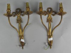 A pair of gilt metal two branch wall lights,