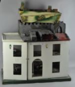 A part built dolls house together with a fort,
