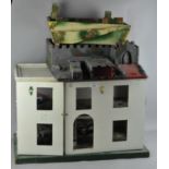 A part built dolls house together with a fort,