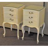 A pair of painted bedside cabinets
