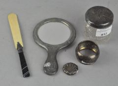 Three silver items, comprising a napkin ring,