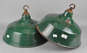 A pair of industrial enamel ceiling lights, outer colour green, inside white,