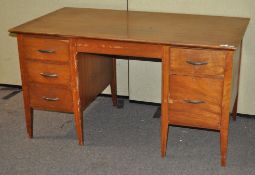 A mid century twin pedestal desk,