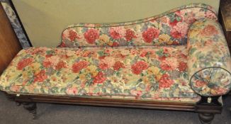 A mahogany chaise longue/day bed with floral upholstery,