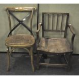 A vintage elbow chair and another chair,