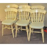 A set of six yellow painted kitchen chairs,