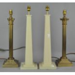 A pair of table lamps of column form,