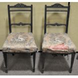 A pair of Victorian ebonised aesthetic style salon chairs,