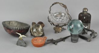 An assortment of collectables, including a hip flask,
