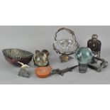 An assortment of collectables, including a hip flask,