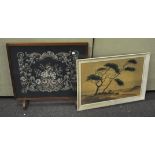 An oak framed fire screen with a floral needlework panel set to centre,