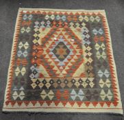A Kelim rug,with geometric and lozenge design,