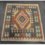 A Kelim rug,with geometric and lozenge design,