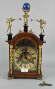 A 20th century oak cased German mantel clock, movement marked FHS, with ornate detailing throughout,