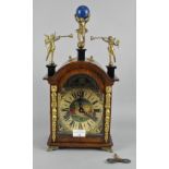 A 20th century oak cased German mantel clock, movement marked FHS, with ornate detailing throughout,