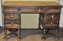 A 19th century oak pedestal desk, with brass handles,