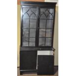 A black and white painted bookcase/ display cabinet, in two parts,